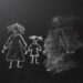 Chalk drawing of a child and parents on a blackboard, divorce trauma concept